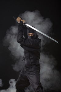 Ninja with sword at night in smoke